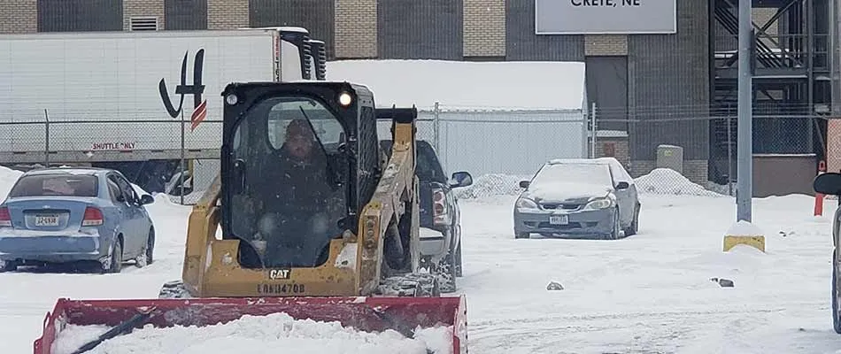 Hire our team to remove snow and ice from your commercial property this winter season.